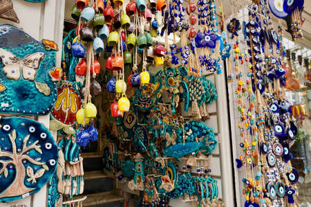 Bodrum, Turkey - August, 2020: souvenirs with evil eyes, masks, lanterns at the local market. Turkish souvenirs of Grand Bazaar. With selective focusのeditorial素材