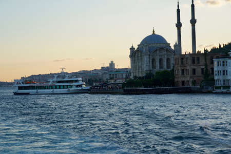 Istanbul skyline at sunset, Turkey. Beautiful cityscape of Istanbul with cruise ships. Traveling and vacation in Istanbul in summer at sunsetの写真素材
