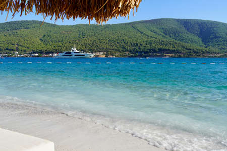 Panoramic Paradise view of the purest turquoise lagoon of the Aegean Sea near Bodrum with boats and yachts, white sand and green mountains Paradise Luxury tourism conceptの写真素材