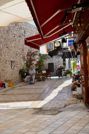 Bodrum, Turkey - August, 2020: View of white street and flowers in Bodrum city of Turkey. Aegean style colorful streetのeditorial素材