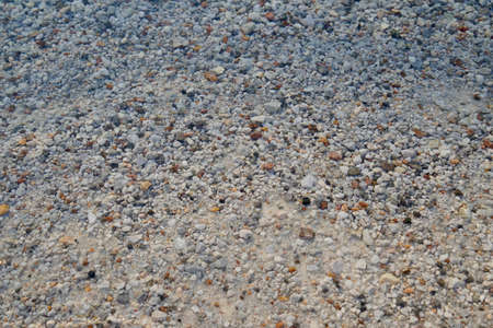 Atlantic Ocean coast with colorful stones of emerald water shellsの写真素材