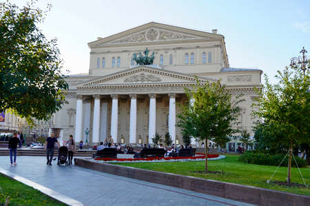Moscow, Russia - August 2020: Beautiful summer view of the Bolshoi Theatre with tourists in the center of Moscow, the main attractions of Russia, Summer landscape with blooming flowerbedsのeditorial素材