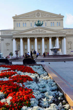 Moscow, Russia - August 2020: Beautiful summer view of the Bolshoi Theatre with tourists in the center of Moscow, the main attractions of Russia, Summer landscape with blooming flowerbedsのeditorial素材