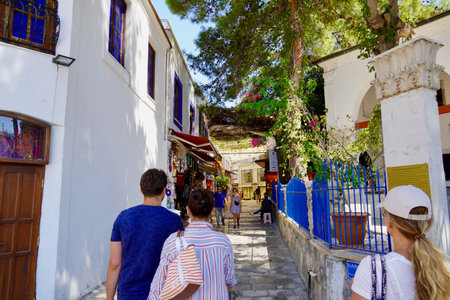 Bodrum, Turkey - August, 2020 Street view in Bodrum, well known for its architecture, vineyards and windmills is a popular summer tourist destination,Tourists walk along narrow streetsの写真素材