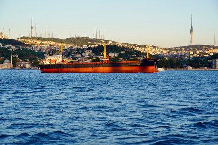 Beautiful Bosphorus strait shore line with all the luxurious mansions, green hills and the boats on the water on a sunny day under the blue sky.の写真素材