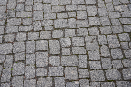 Old gray pavement in historical city centreの写真素材