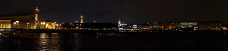 Saint Petersburg. Russia. Panoramic view. The Palace bridge is divorced. Raising of the bridges. Bridges Of Petersburg. View from the Neva to the Hermitage. Winter palace in the evening. Panorama of the city. Blue illuminated of the bridge. One of the main landscapes of Saint-Petersburgの写真素材