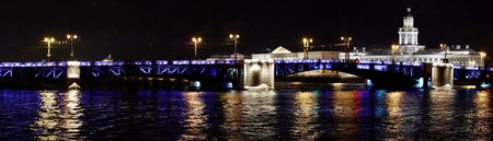 Saint Petersburg. Russia. Panoramic view. The Palace bridge is divorced. Raising of the bridges. Bridges Of Petersburg. View from the Neva to the Hermitage. Winter palace in the evening. Panorama of the city. Blue illuminated of the bridge. One of the main landscapes of Saint-Petersburgの写真素材