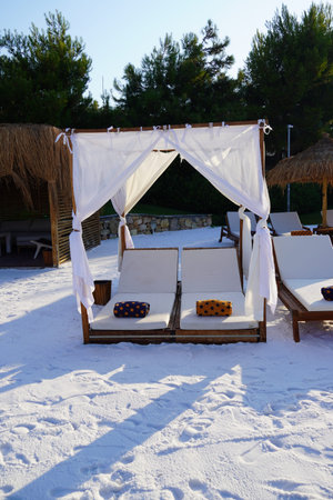 Beautiful beach landscape at Lux hotel, Sunbed on white sandの写真素材