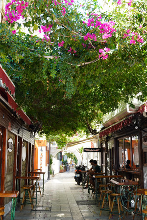 Bodrum, Turkey - August, 2020: Tourists at Marina Bay bazaar in Bodrum see souvenirs in the narrow streets. Stores for tourists. Authentic goods for travelers. Souvenirs in Bodrum. Oriental flavor andの写真素材