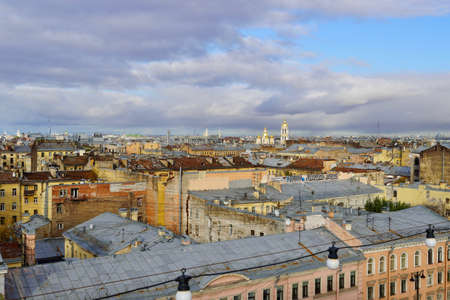 Panorama view, Concept for real estate panoramic modern cityscape building bird eye aerial view under sunrise and morning blue bright sky in St.Petersburg, Russia Urban landscape contrast the plants pipe and the domes of the church against a beautiful sky. Rooftop view.The sunlight beautifully illuminates the domes and roofs of St. Petersburg houses. Historical and modern cent of the North capital of Russiaの写真素材