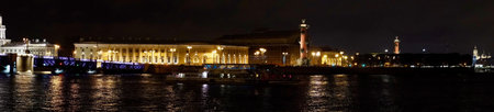 Saint Petersburg. Russia. Panoramic view. The Palace bridge is divorced. Raising of the bridges. Bridges Of Petersburg. View from the Neva to the Hermitage. Winter palace in the evening. Panorama of the city. Blue illuminated of the bridge. One of the main landscapes of Saint-Petersburgの写真素材