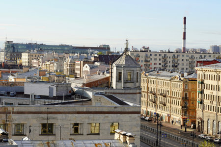Panorama view, Concept for real estate panoramic modern cityscape building bird eye aerial view under sunrise and morning blue bright sky in St.Petersburg, Russia. Urban landscape contrast the plants pipe and the domes of the church against a beautiful sky. Rooftop view.The sunlight beautifully illuminates the domes and roofs of St. Petersburg houses. Historical and modern center of the North capital of Russiaの写真素材