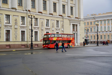 St. Petersburg, Russia - November, 2020 Sightseeing Tour Buses in Front of Saint Isaacs Cathedral. Hop On Hop Off Tourist Bus and Group Tour Red Bus for Guided Tours on Empty Street with Copy Space. Double Decker bus for tourists. North capital of Russiaのeditorial素材