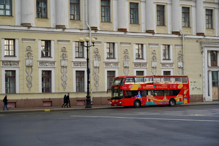 St. Petersburg, Russia - November, 2020 Sightseeing Tour Buses in Front of Saint Isaacs Cathedral. Hop On Hop Off Tourist Bus and Group Tour Red Bus for Guided Tours on Empty Street with Copy Space. Double Decker bus for tourists. North capital of Russiaのeditorial素材