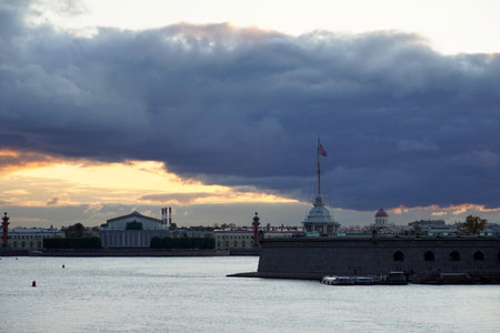 Stunning Panoramic view of Tain-Petersburg at sunrise. Peter and Paul Fortress is original citadel of St. Petersburg, Russia, founded by Peter Great in 1703 and built to Trezzinis designs as star fortress. Peter and Paul Fortress. View across Neva river. Waterfront Big Neva, Dramatic sky,の写真素材