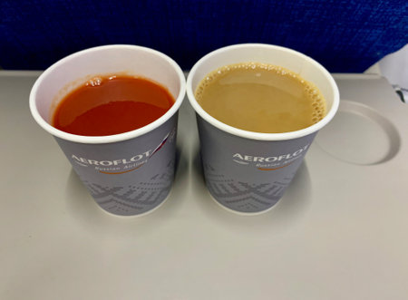 Moscow, Russia - August, 2020: Tomato juice and cappuccino on board an Aeroflot aircraft in business classのeditorial素材