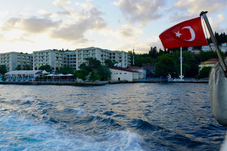 Istanbul, Bodrum - August 2020: Tour boats travel around the Bosphorus Canal on clear summer days. Sea cruise past Dolmabahce Palaceのeditorial素材
