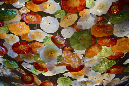 Glade of artificial plastic interior colors. Yellow brown red white flowers for interior decorationの写真素材