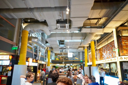 Moscow, Russia - September 2020 view of people sitting in foodcourt cafe in the shopping mall Depo Moscow in the historical centre of the capital, Fastfood, vegan foodのeditorial素材