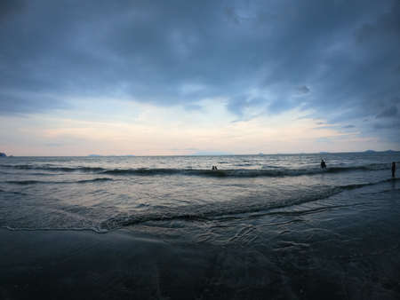 Sunset moment at the beach with amazing nature wave with bluebackgroundの写真素材