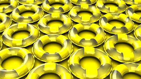 Yellow swim rings on yellow backgroundの写真素材