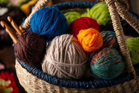 Yarn Balls and crochet needles in basket.の写真素材