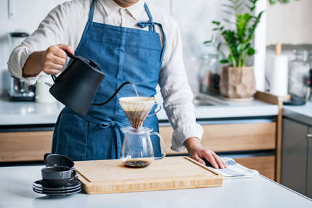 Man making coffee in the kitchen.
Delicious coffee image.の写真素材