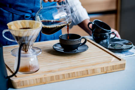 Man making coffee in the kitchen.
Delicious coffee image.の写真素材