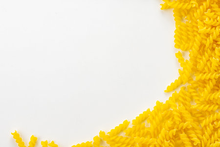Uncooked fusilli pasta on white background.
Italian food fusilli pasta image for background.の写真素材