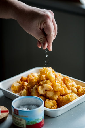 Male cooking Okaki (Japanese rice crackers).
Japanese traditional snack image.
