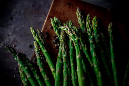 Fresh green asparagus on wooden cutting board.
Delicious green asparagus image.の写真素材