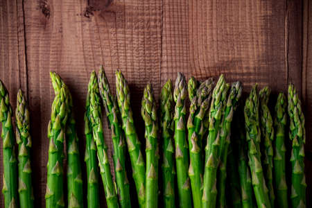 Fresh green asparagus on wooden background.
Delicious green asparagus image.の写真素材