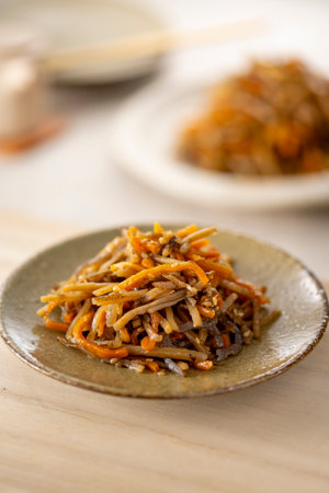 Kinpira gobo, a traditional Japanese dish made from minced burdock stewed in sugar and soy sauce.の写真素材