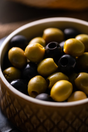 Green and Black Olives.This close-up features vibrant green and rich black olives, perfect for culinary, health, or natural food themes.の写真素材