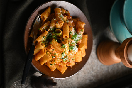 Rigatoni Pasta Dish A close-up photo of a rigatoni pasta dish served on a plate. Perfect for food, restaurant, or culinary-themed projects.の写真素材