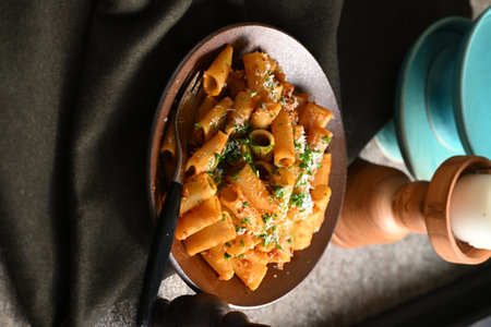 Rigatoni Pasta Dish A close-up photo of a rigatoni pasta dish served on a plate. Perfect for food, restaurant, or culinary-themed projects.の写真素材
