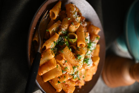 Rigatoni Pasta Dish A close-up photo of a rigatoni pasta dish served on a plate. Perfect for food, restaurant, or culinary-themed projects.の写真素材