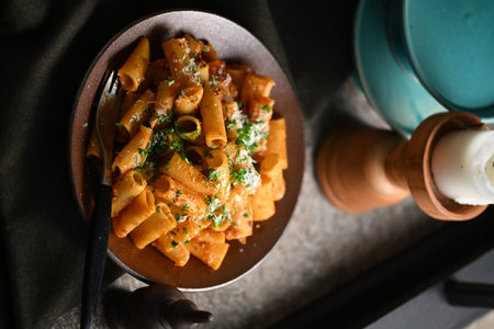Rigatoni Pasta Dish A close-up photo of a rigatoni pasta dish served on a plate. Perfect for food, restaurant, or culinary-themed projects.の写真素材