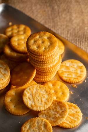 Round Crackers Snack A close-up photo of round crackers. Perfect for food, snack, bakery, or cooking-related projects.の写真素材