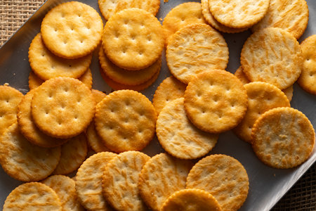 Round Crackers Snack A close-up photo of round crackers. Perfect for food, snack, bakery, or cooking-related projects.の写真素材