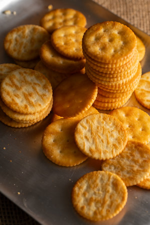 Round Crackers Snack A close-up photo of round crackers. Perfect for food, snack, bakery, or cooking-related projects.の写真素材