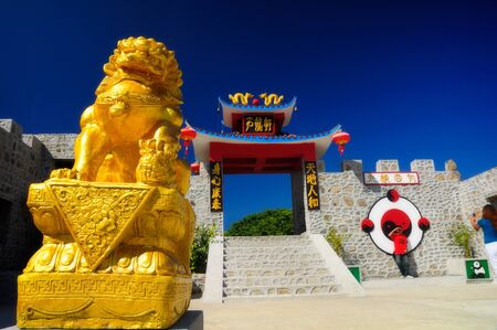 PAI, MAE HONG SON, THAILAND - DEC 30, 2010 Chinese golden lion statue is located in the blue sky. Tourist attractions famous of Pai, Mae Hong Son.のeditorial素材