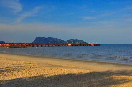 Red bridge that extends to the sea, Saran Withi Bridge Is an important tourist destination of Prachuap Khiri Khan Province, Thailand.の写真素材