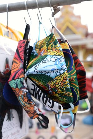 Mask with a variety of patterns Hanging on the waiting rack for saleの写真素材