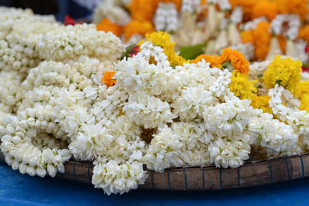 The garland is made of jasmine, dahlia, marigold on a pannier.の写真素材