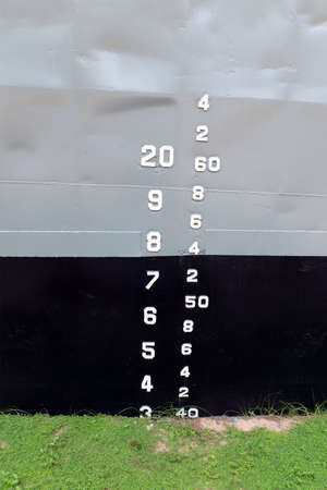 The numbers tell the depth of the water. On the side of the ship.の写真素材