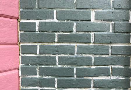 Green brick wall background and pink concrete side loft style.の写真素材