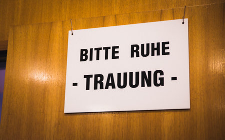 german wedding sign to be quiet at registry officeの写真素材