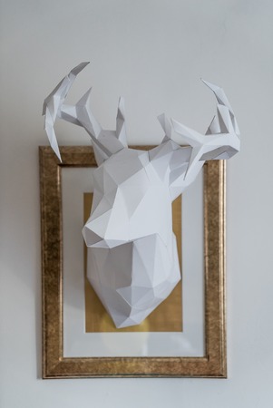 origami paper model of white stag head vault sculptureの写真素材